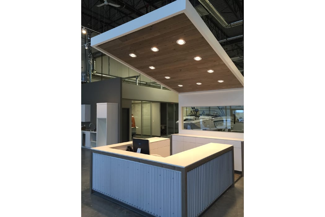 A large open office with an overhead ceiling.
