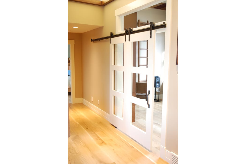 A sliding barn door in the center of a room.