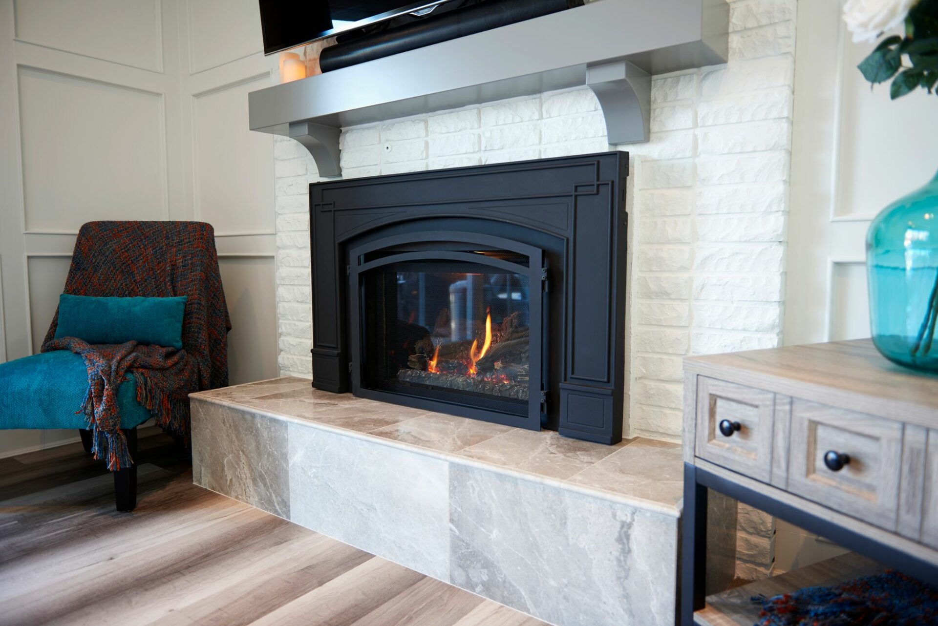 A fireplace with a fire place in the center of it.