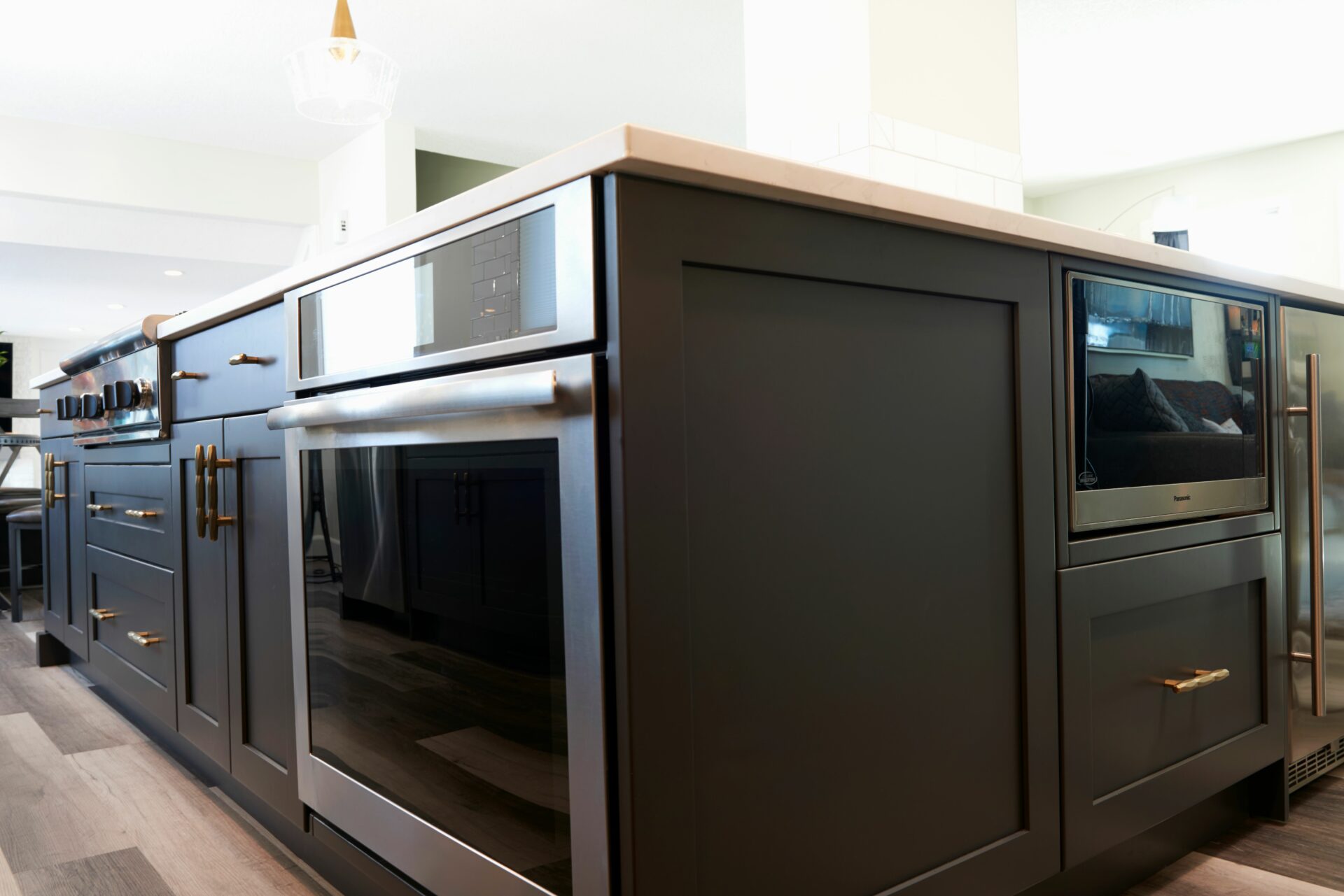 A kitchen with an oven and microwave in it